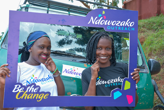 Team members beside the outreach van